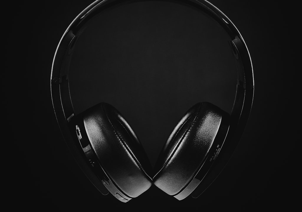 Premium closed back gaming headset beside RGB mechanical keyboard